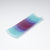 A rectangular ColourWave Glass fused glass plate, boasting a vibrant gradient from turquoise to deep blue and purple in vertical stripes. The plate’s corners elegantly curve upwards, adding a modern twist to its design. The smooth transition of colours offers a serene visual experience, while the craftsmanship reflects a high level of skill in glass work